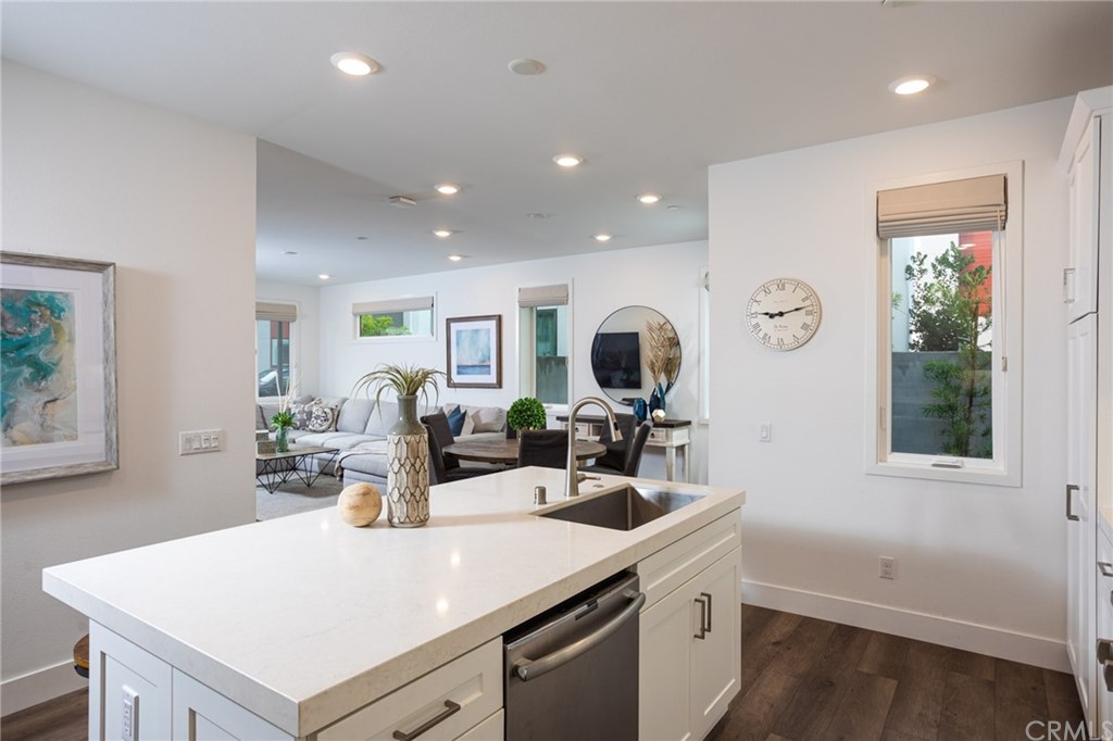 82 Ballast Point Tustin, CA 92782 - Photo 8 of 30 a kitchen with a sink a counter space and living room