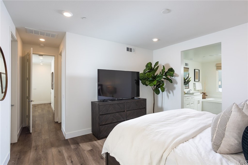 82 Ballast Point Tustin, CA 92782 - Photo 10 of 30 a bedroom with a bed and a flat screen tv