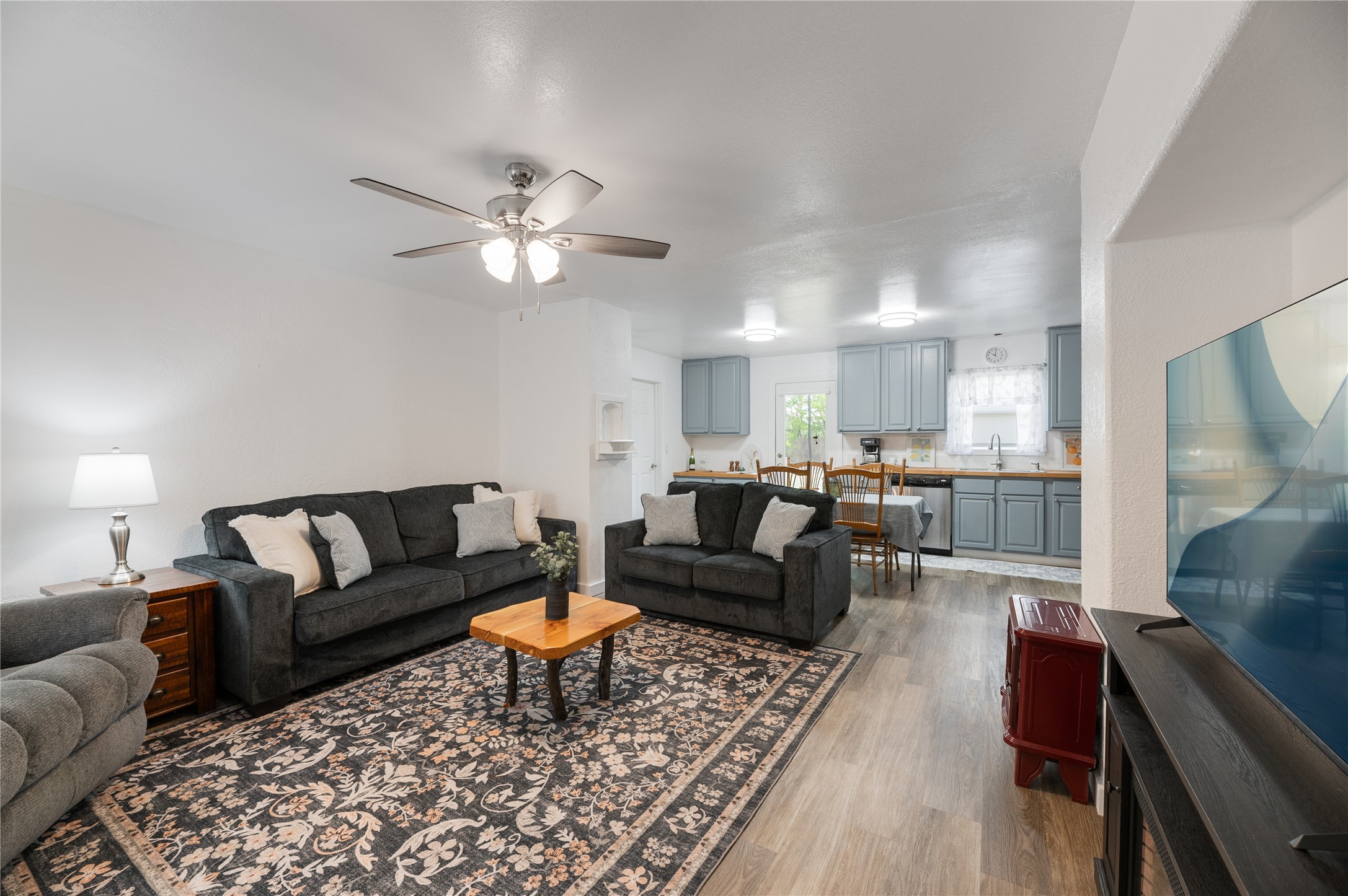 445 West Vaughan Street Bertram, TX 78605 - Photo 1 of 23 a living room with furniture and a view of kitchen