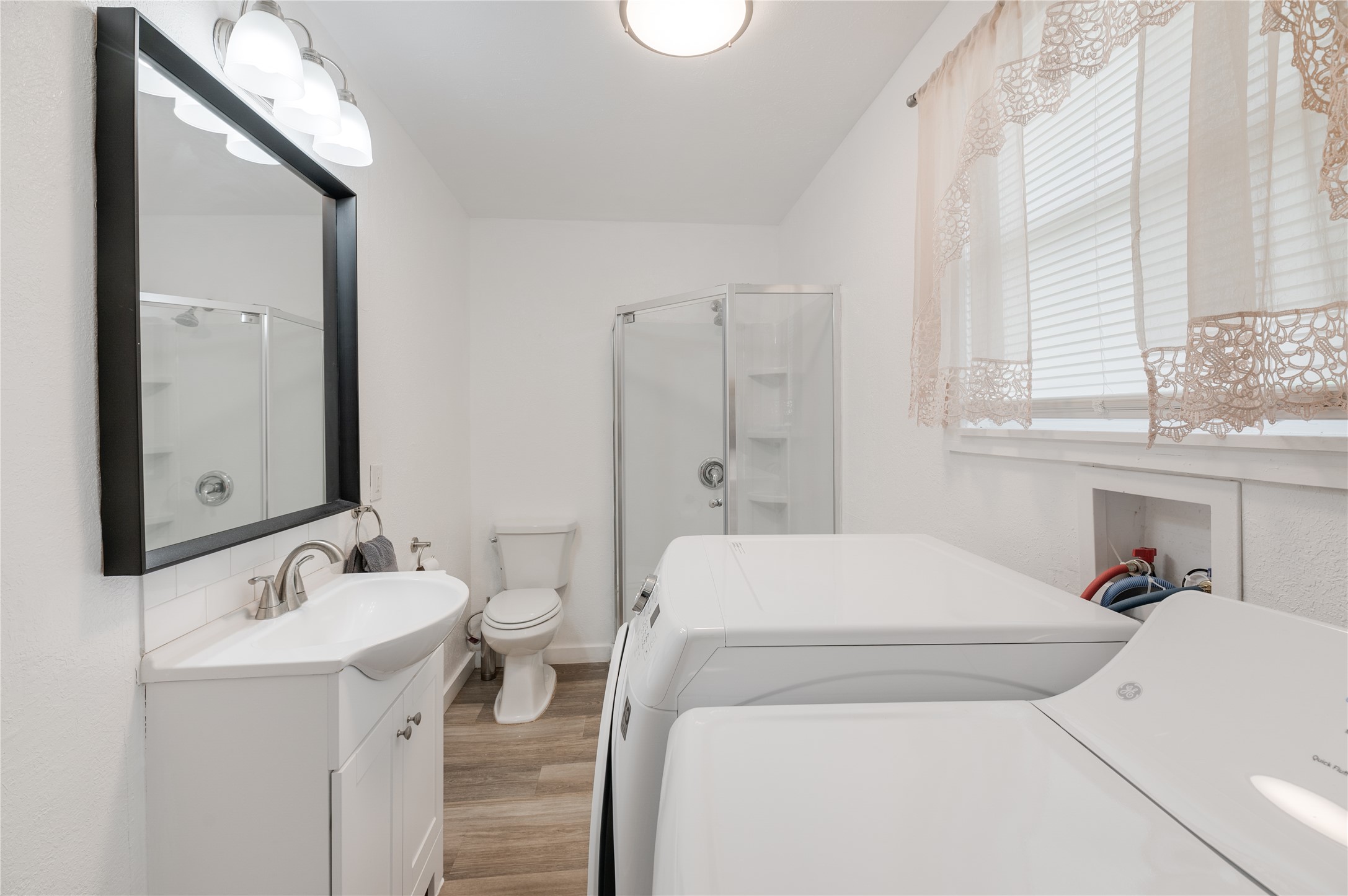 445 West Vaughan Street Bertram, TX 78605 - Photo 14 of 23 a utility room with dryer and washer