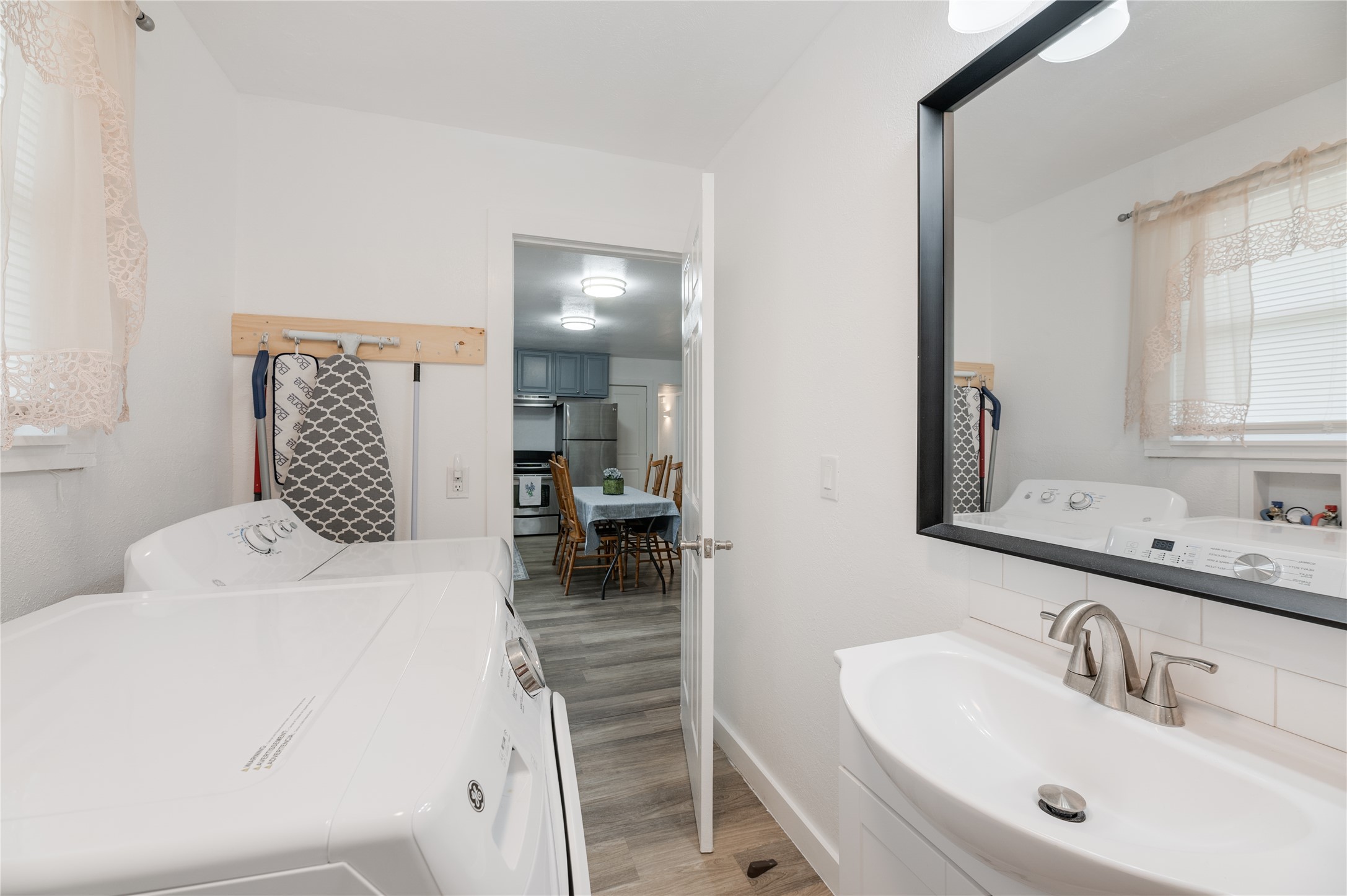 445 West Vaughan Street Bertram, TX 78605 - Photo 15 of 23 a en suite bathroom with a sink a mirror and shower