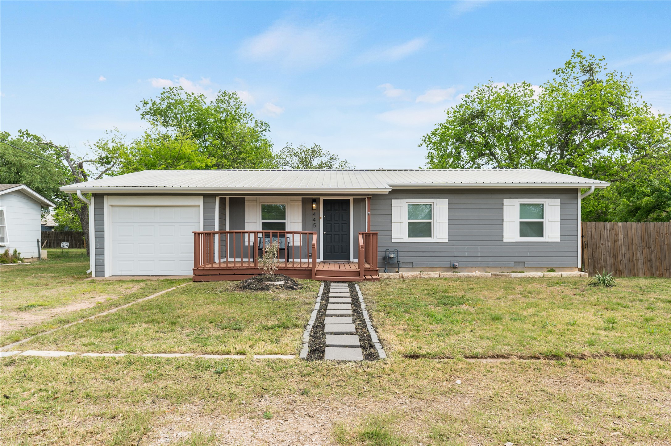 445 West Vaughan Street Bertram, TX 78605 - Photo 16 of 23 a view of a house with back yard