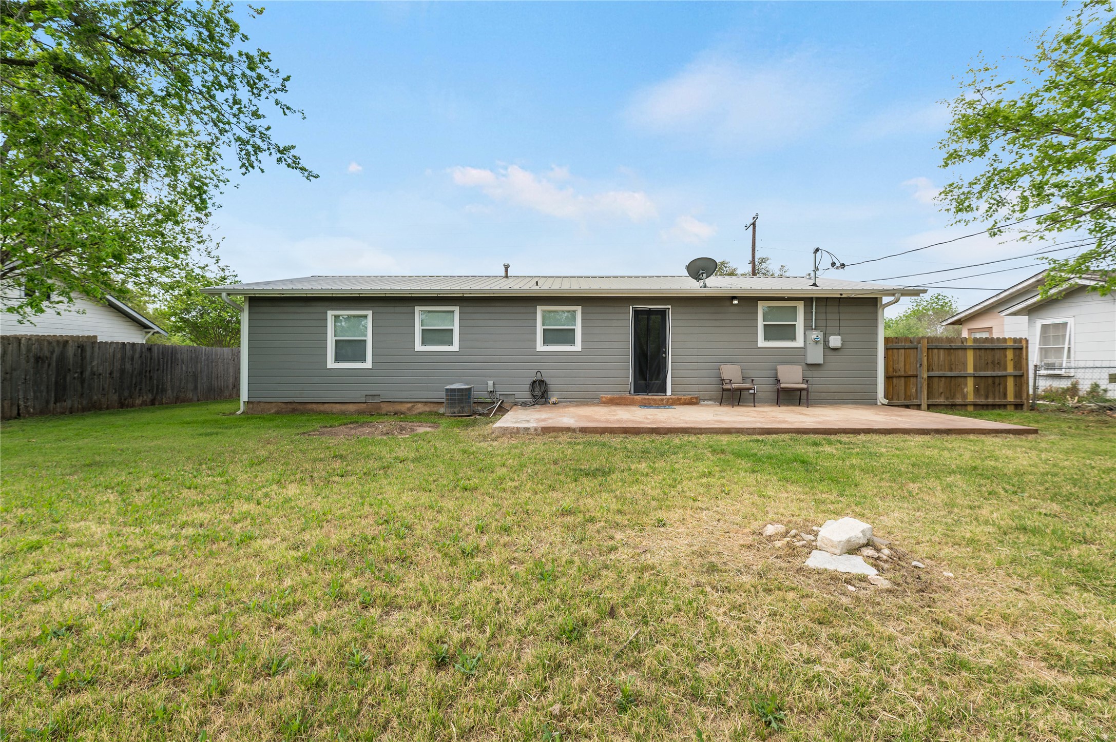 445 West Vaughan Street Bertram, TX 78605 - Photo 17 of 23 a front view of house with yard and green space