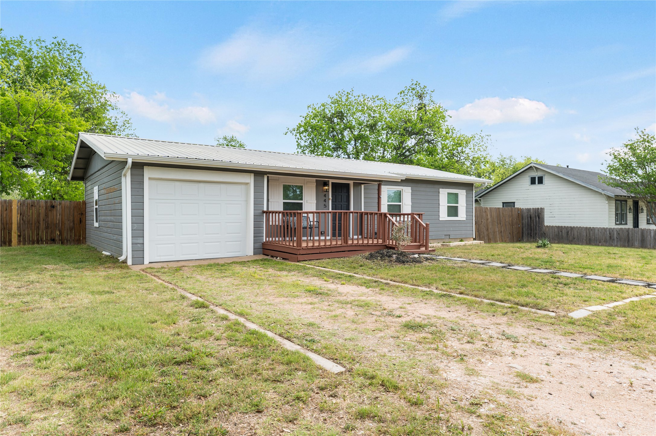 445 West Vaughan Street Bertram, TX 78605 - Photo 18 of 23 a view of a house with pool and a yard