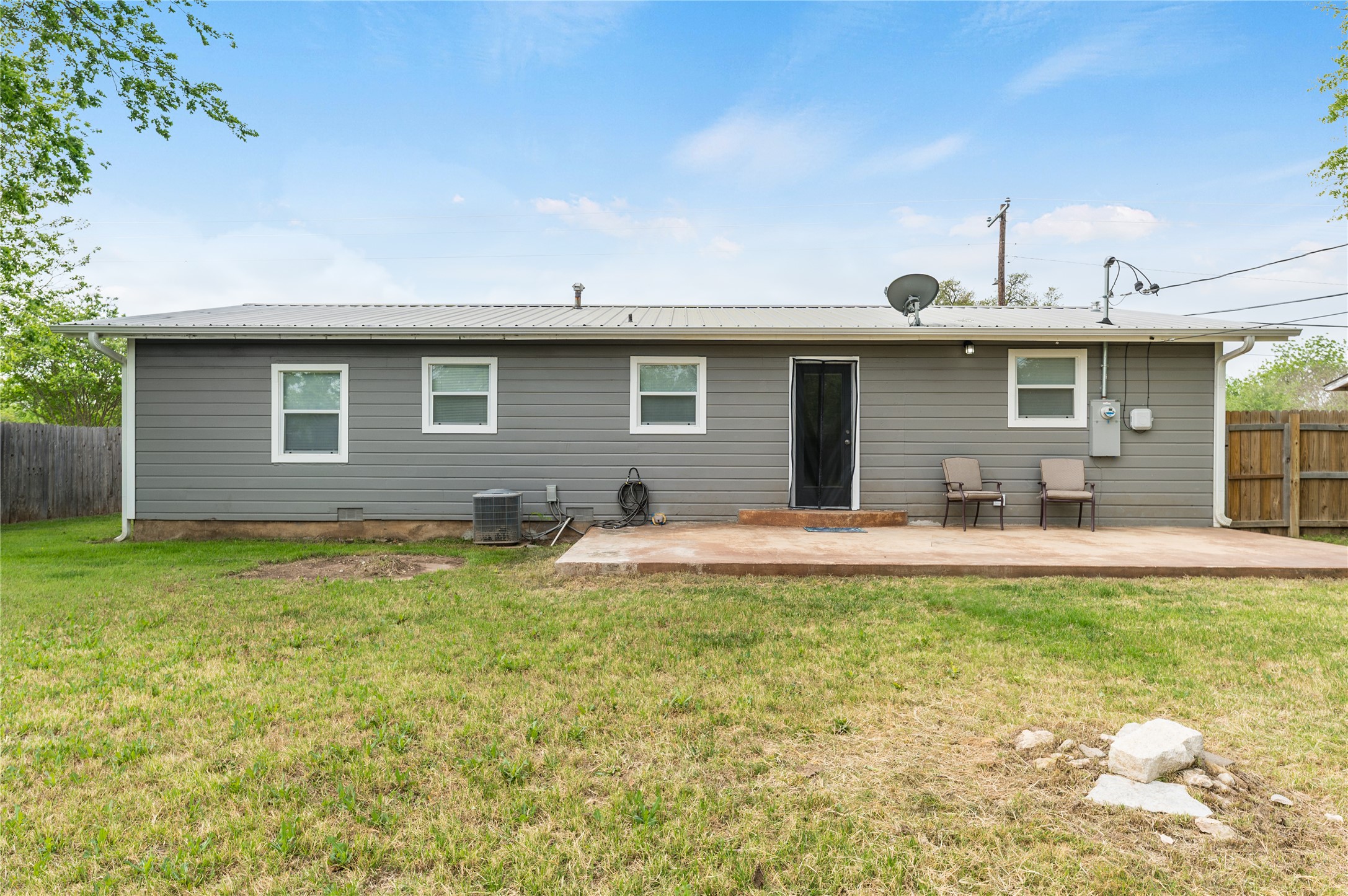 445 West Vaughan Street Bertram, TX 78605 - Photo 19 of 23 a front view of a house with swimming pool