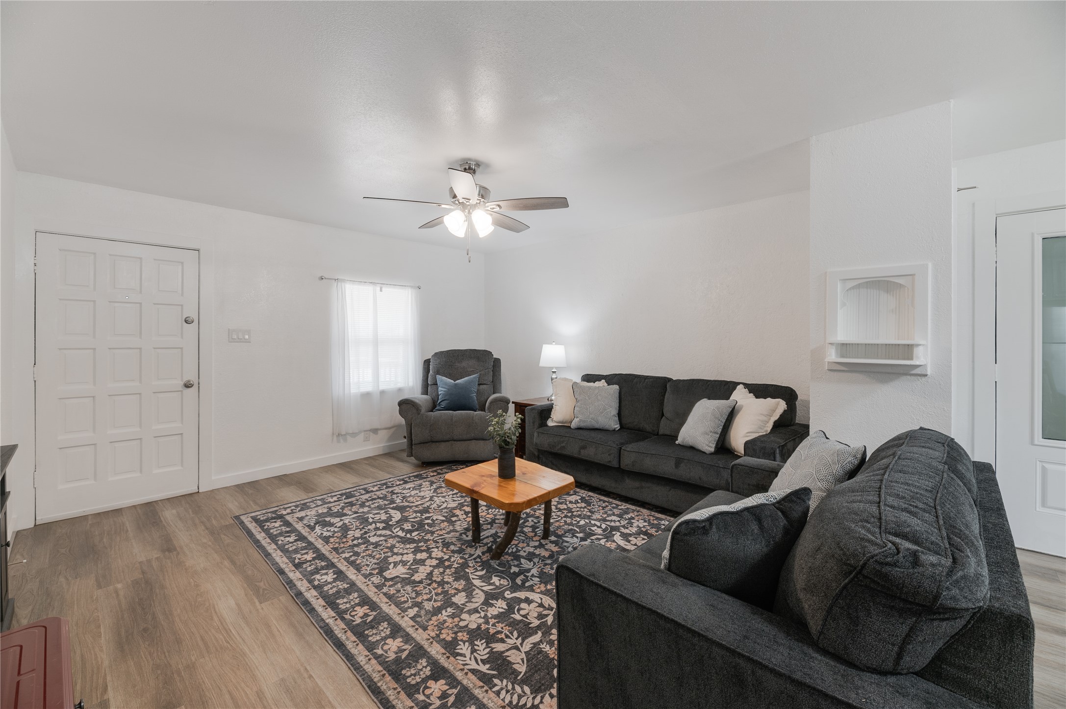 445 West Vaughan Street Bertram, TX 78605 - Photo 2 of 23 a living room with furniture and a chandelier