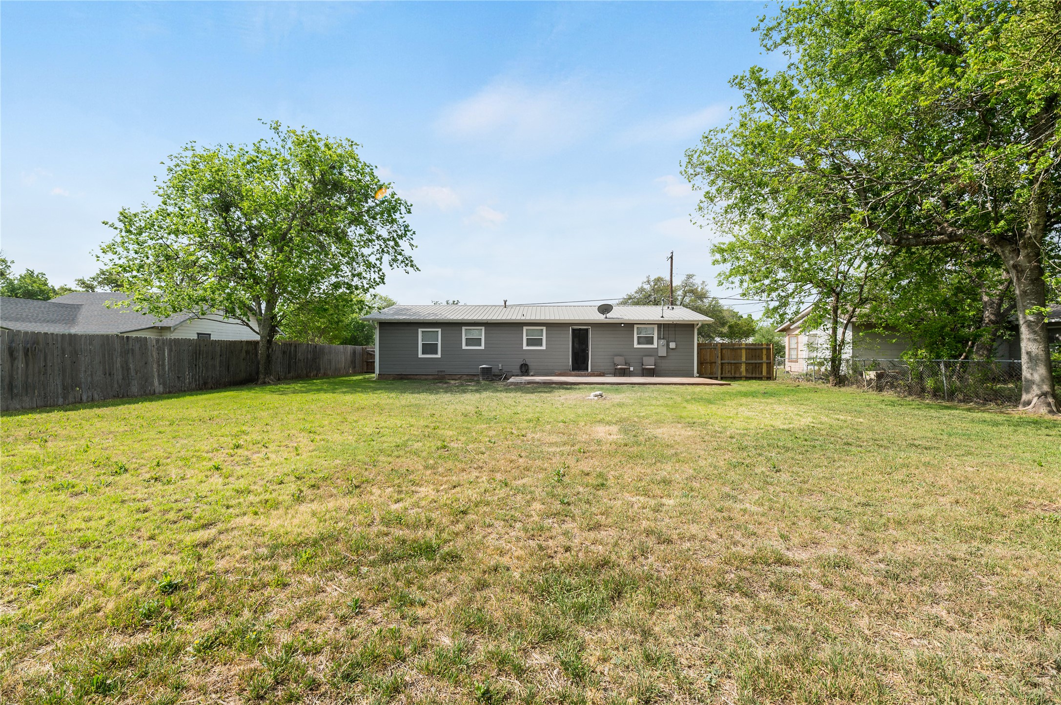 445 West Vaughan Street Bertram, TX 78605 - Photo 21 of 23 a front view of a house with a yard