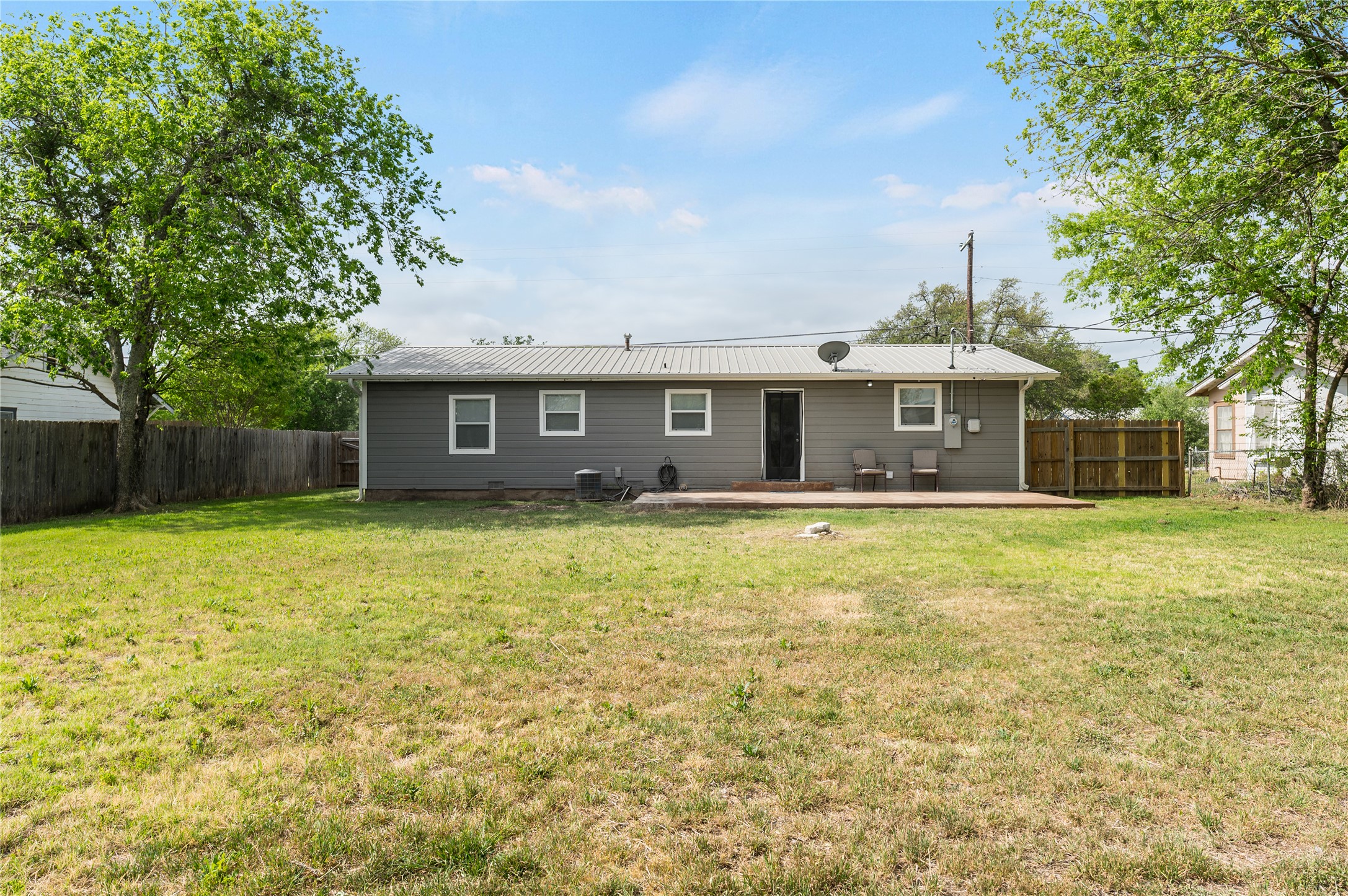 445 West Vaughan Street Bertram, TX 78605 - Photo 22 of 23 a front view of a house with a garden