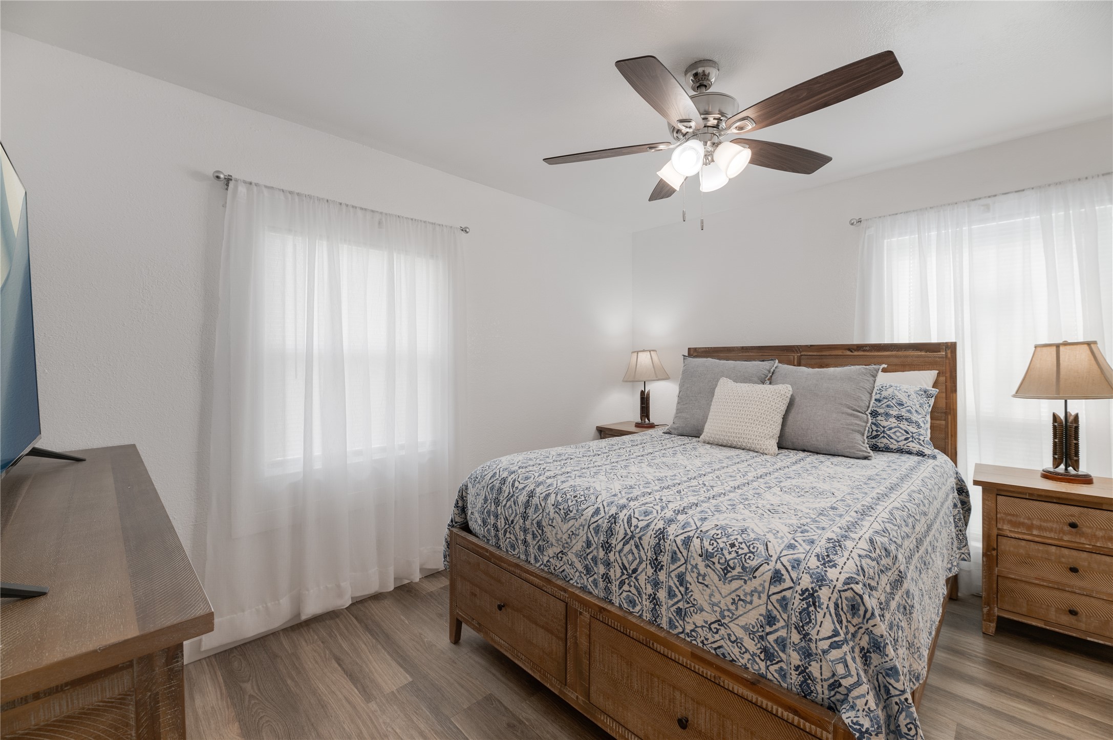 445 West Vaughan Street Bertram, TX 78605 - Photo 8 of 23 a bedroom with a bed and window