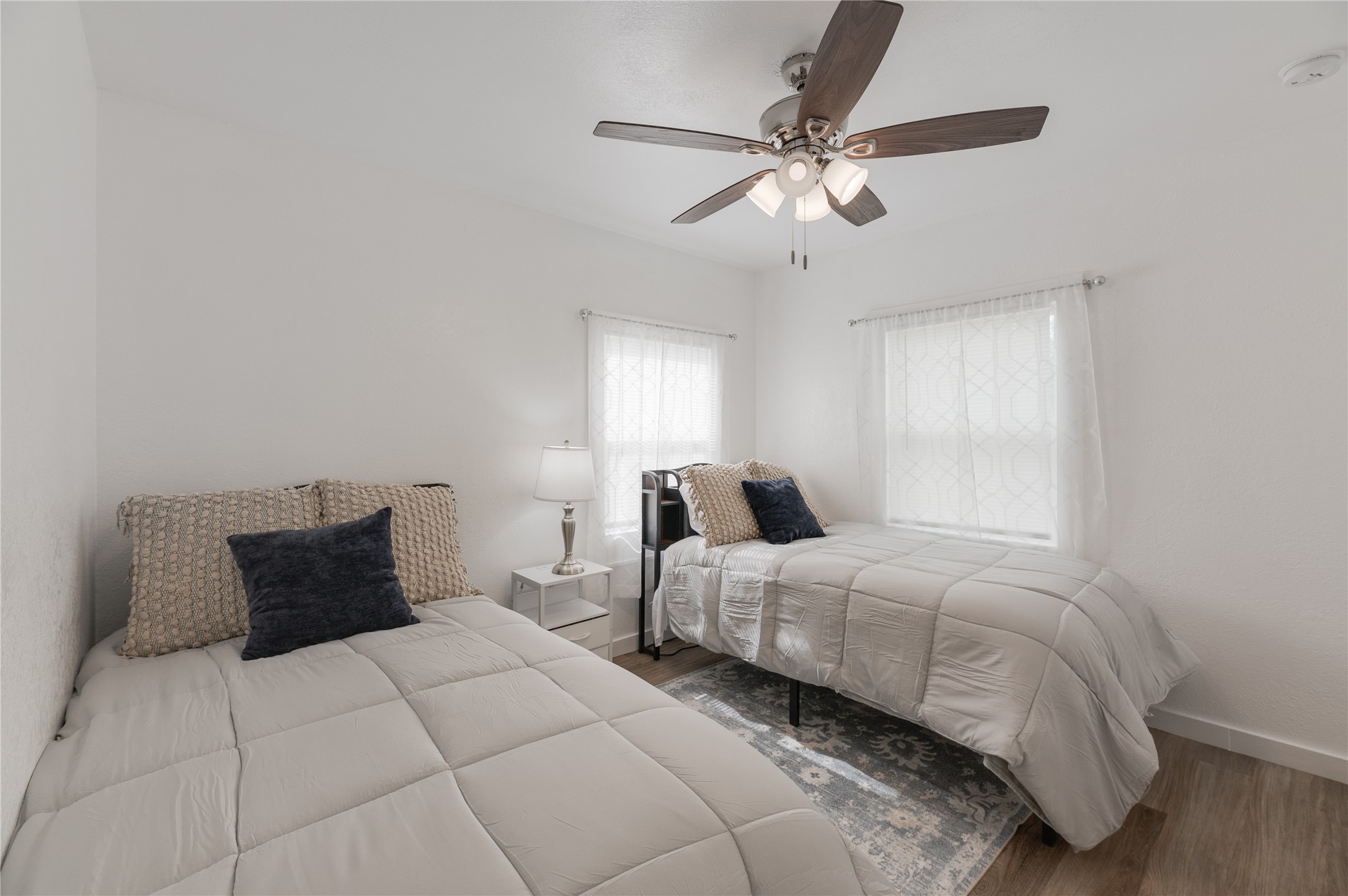 445 West Vaughan Street Bertram, TX 78605 - Photo 10 of 23 a bedroom with a bed and window