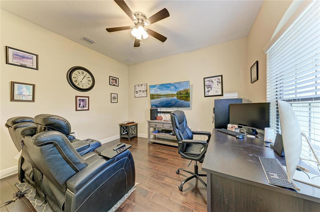 12642 Harney Street Venice, FL 34293 - Photo 28 of 85 a view of a livingroom with workspace and a window