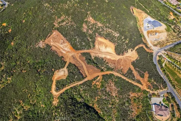 an aerial view of a house with swimming pool