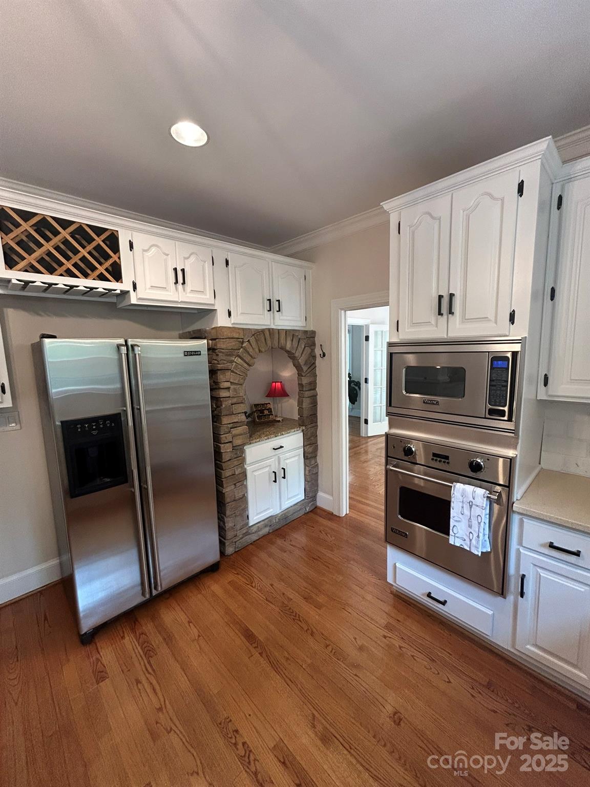5300 Green Rea Road Charlotte, NC 28226 - Photo 11 of 42 a kitchen with stainless steel appliances a stove a microwave and a hard wood floors