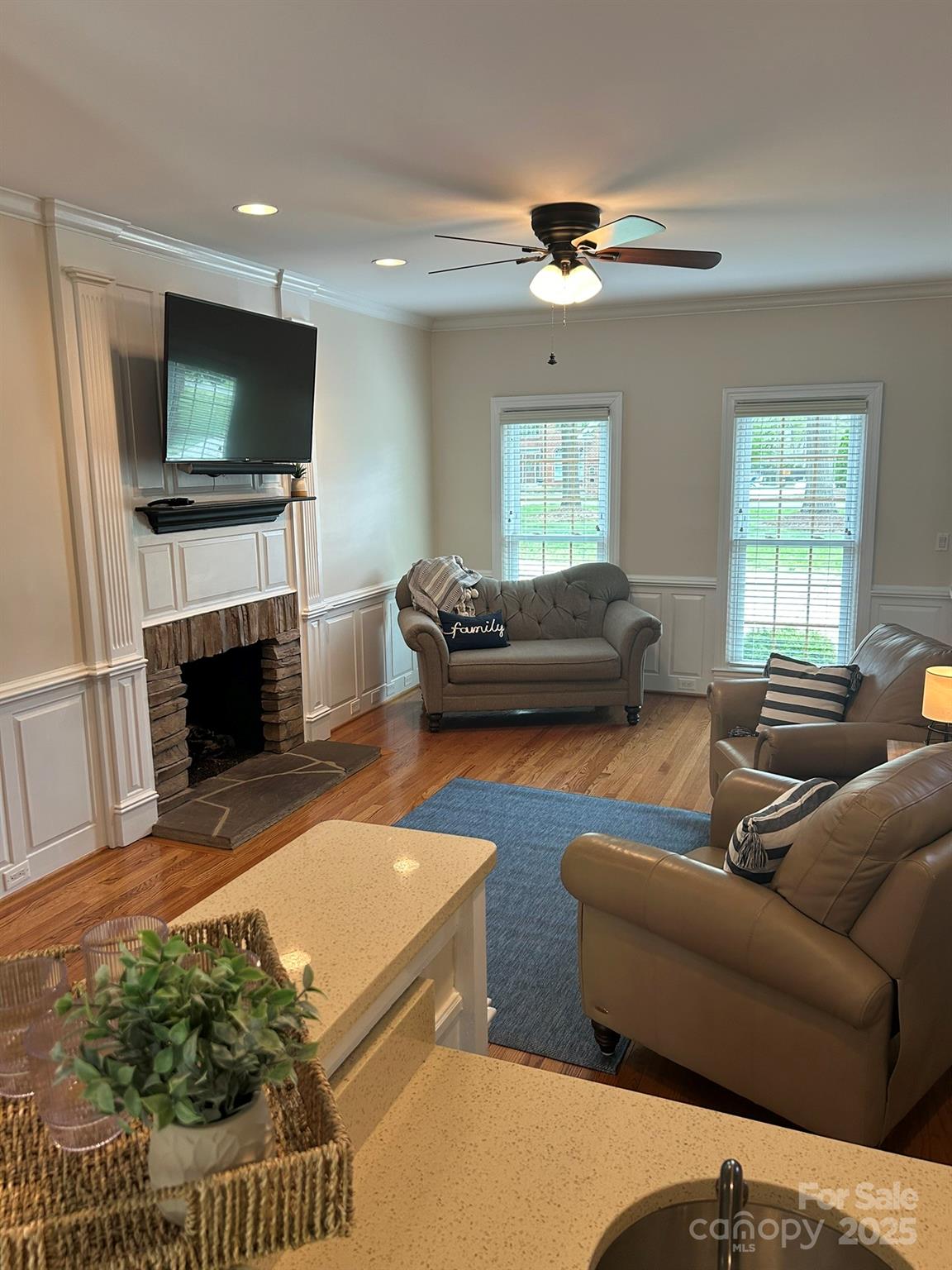5300 Green Rea Road Charlotte, NC 28226 - Photo 13 of 42 a living room with furniture a flat screen tv and a fireplace