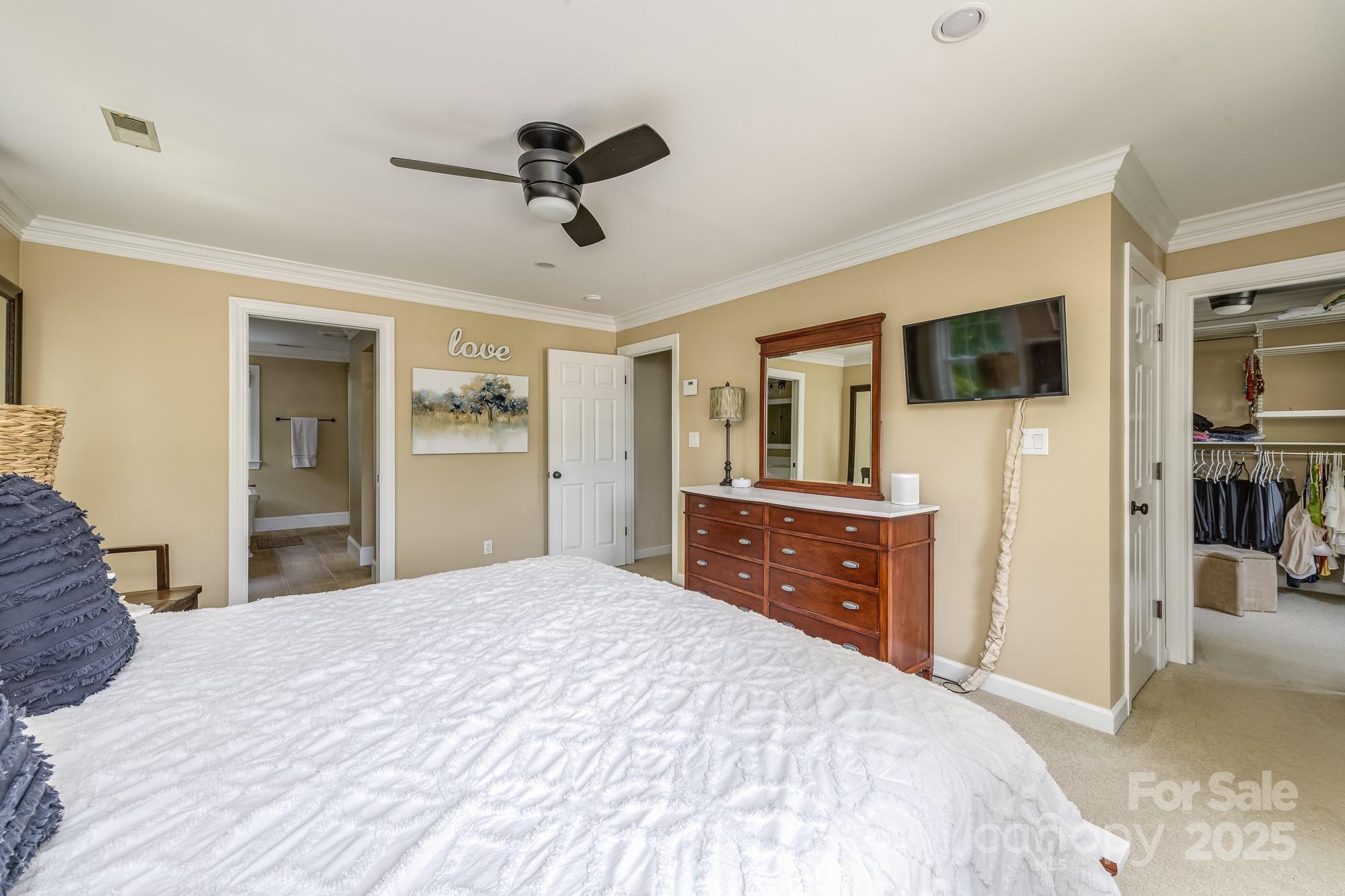 5300 Green Rea Road Charlotte, NC 28226 - Photo 27 of 42 a bedroom with a bed and a flat screen tv