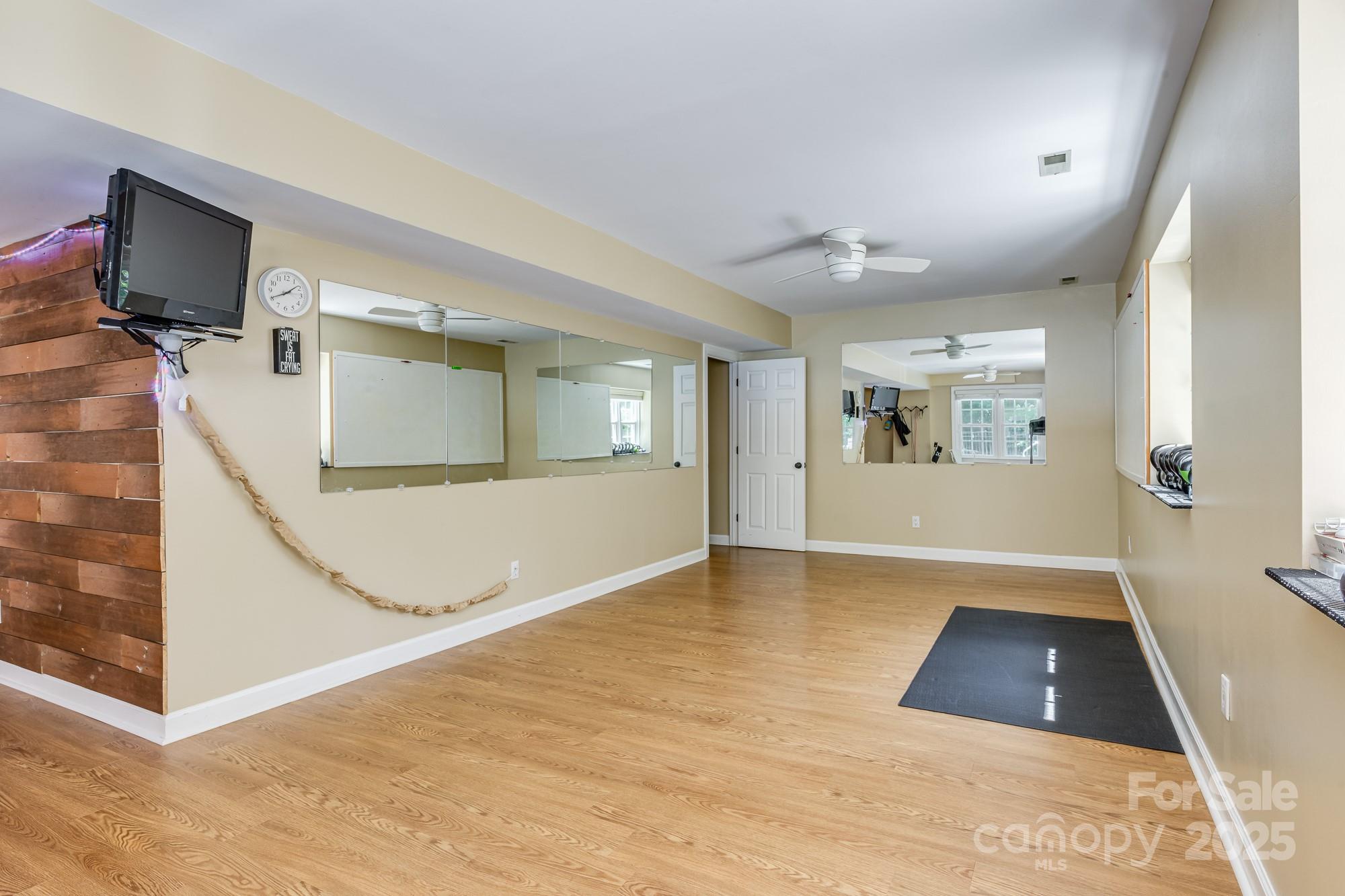 5300 Green Rea Road Charlotte, NC 28226 - Photo 33 of 42 a view of a big room with wooden floor and windows