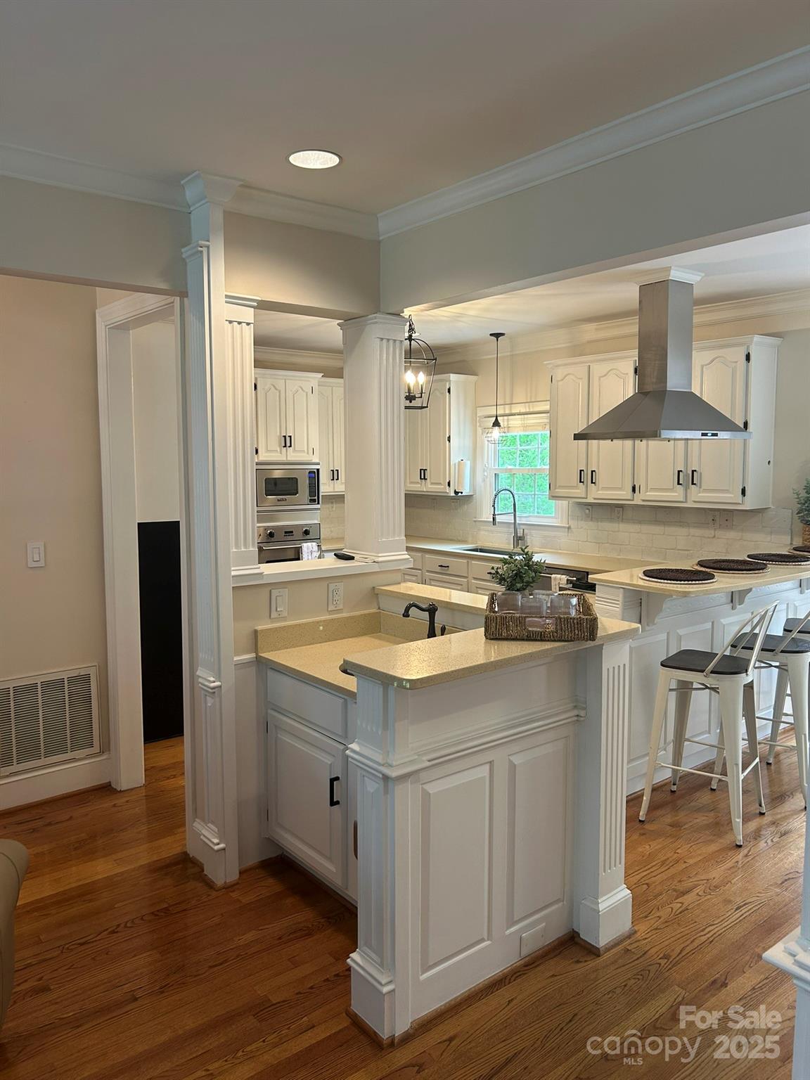 5300 Green Rea Road Charlotte, NC 28226 - Photo 6 of 42 a kitchen with a sink cabinets and wooden floor