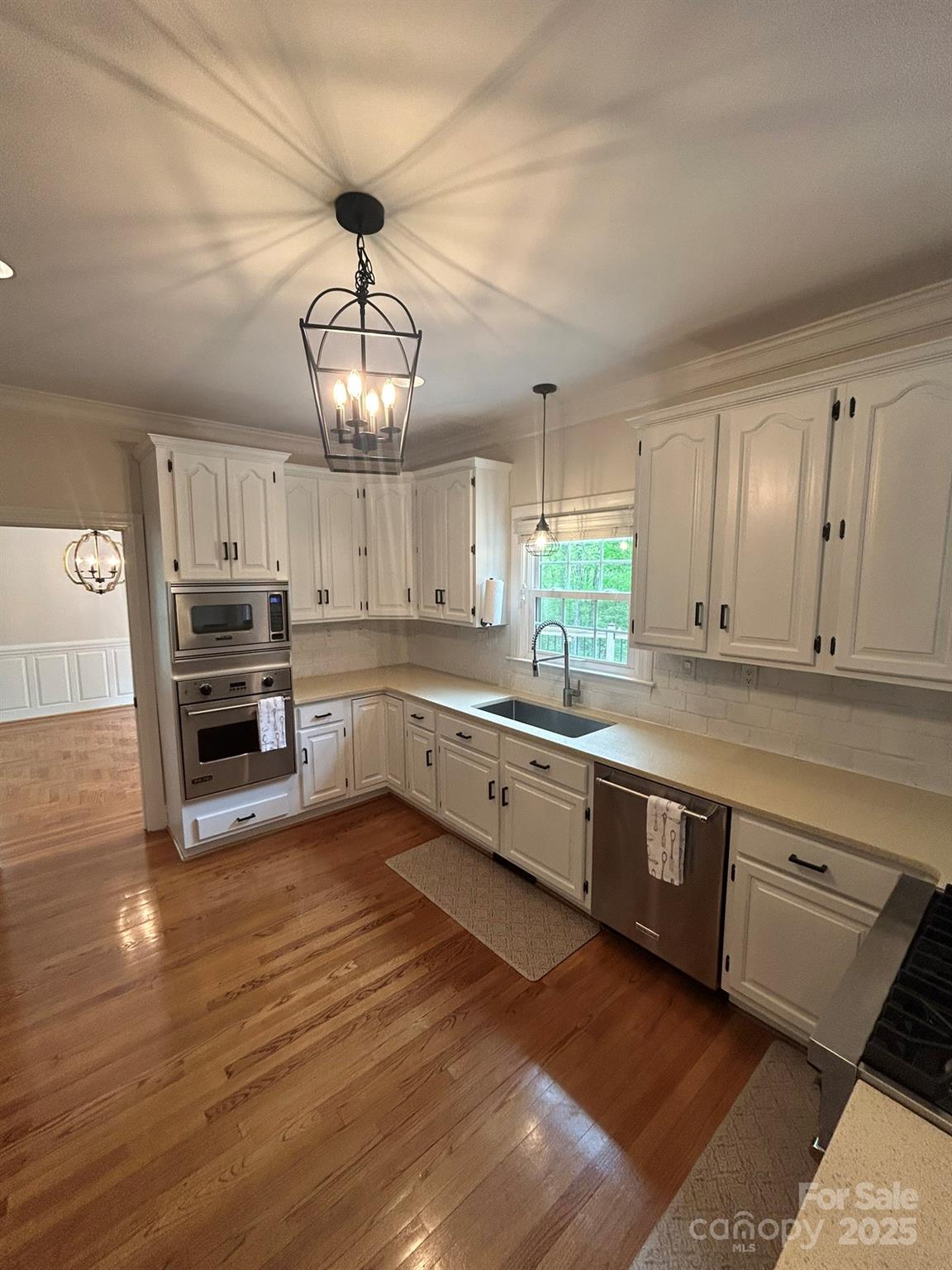 5300 Green Rea Road Charlotte, NC 28226 - Photo 7 of 42 a large kitchen with granite countertop a large counter space a sink appliances and cabinets