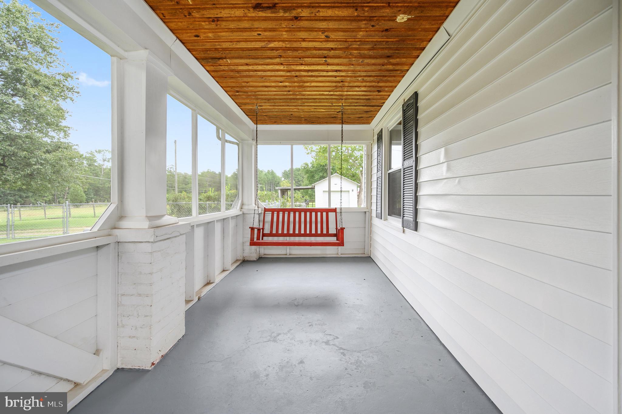 15390 Round Hill Road King George, VA 22485 - Photo 14 of 104 Charming screened in porch with porch swing!
