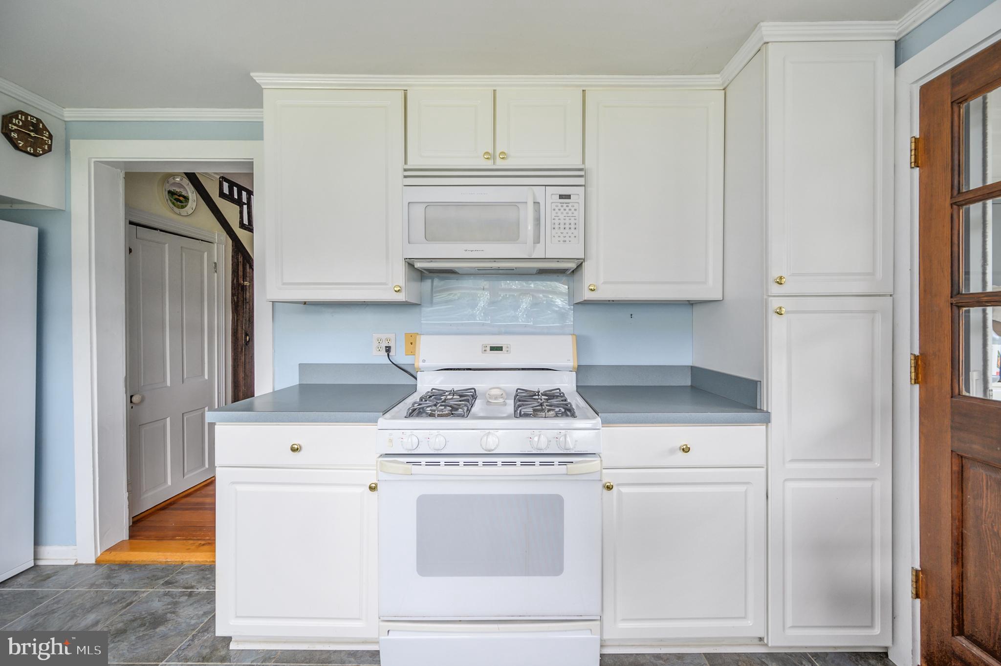 15390 Round Hill Road King George, VA 22485 - Photo 59 of 104 Gas cook stove, microwave & cabinet pantry!