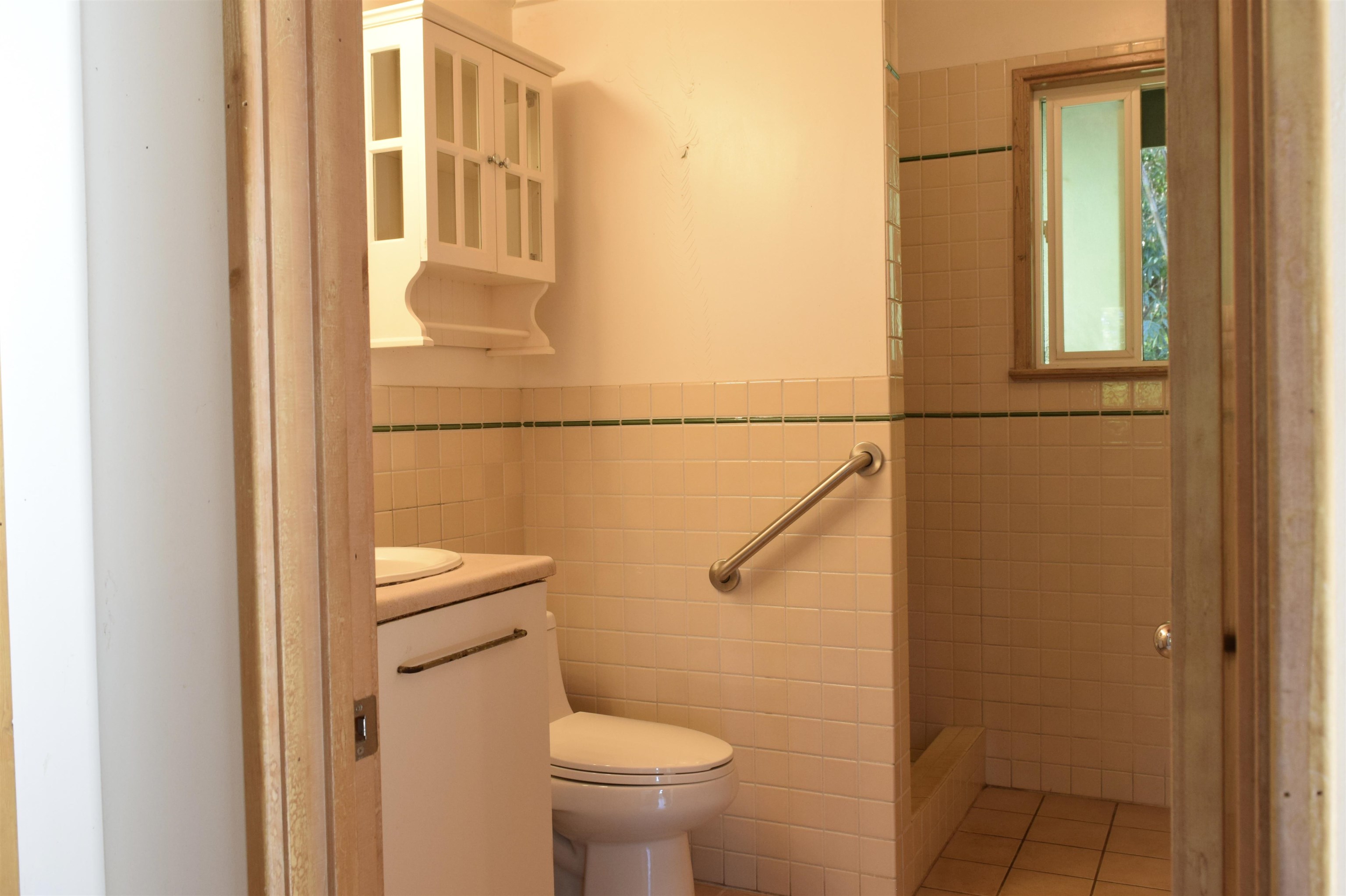 616 West Kuiaha Road Haiku, HI 96708 - Photo 23 of 30 a bathroom with a granite countertop toilet and a sink