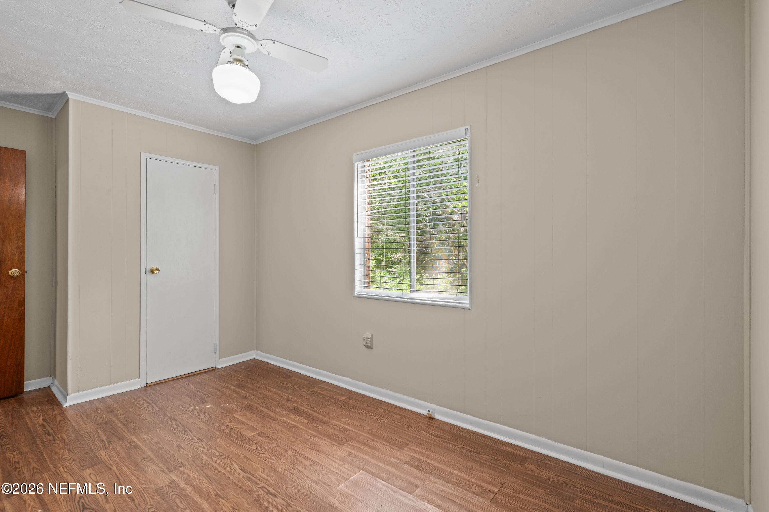 253 Cowry Road St. Augustine, FL 32086 - Photo 21 of 27 wooden floor in an empty room with a window