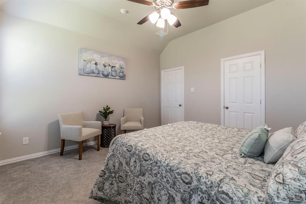 626 Ruthye Lane Pilot Point, TX 76258 - Photo 7 of 27 Bedroom with carpet floors, lofted ceiling, and a ceiling fan