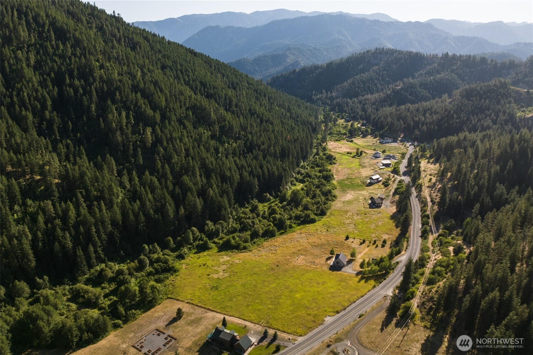 a view of a yard with table and chairs