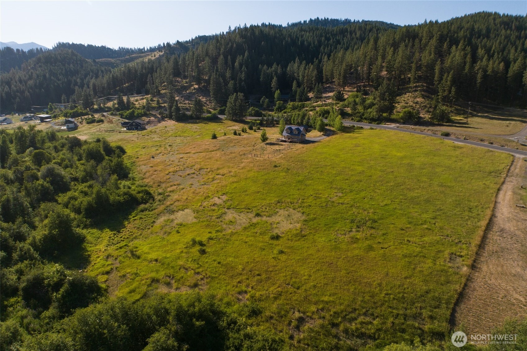 10479 Eagle Creek Road Leavenworth, WA 98826 - Photo 2 of 25 a view of a swimming pool with a yard