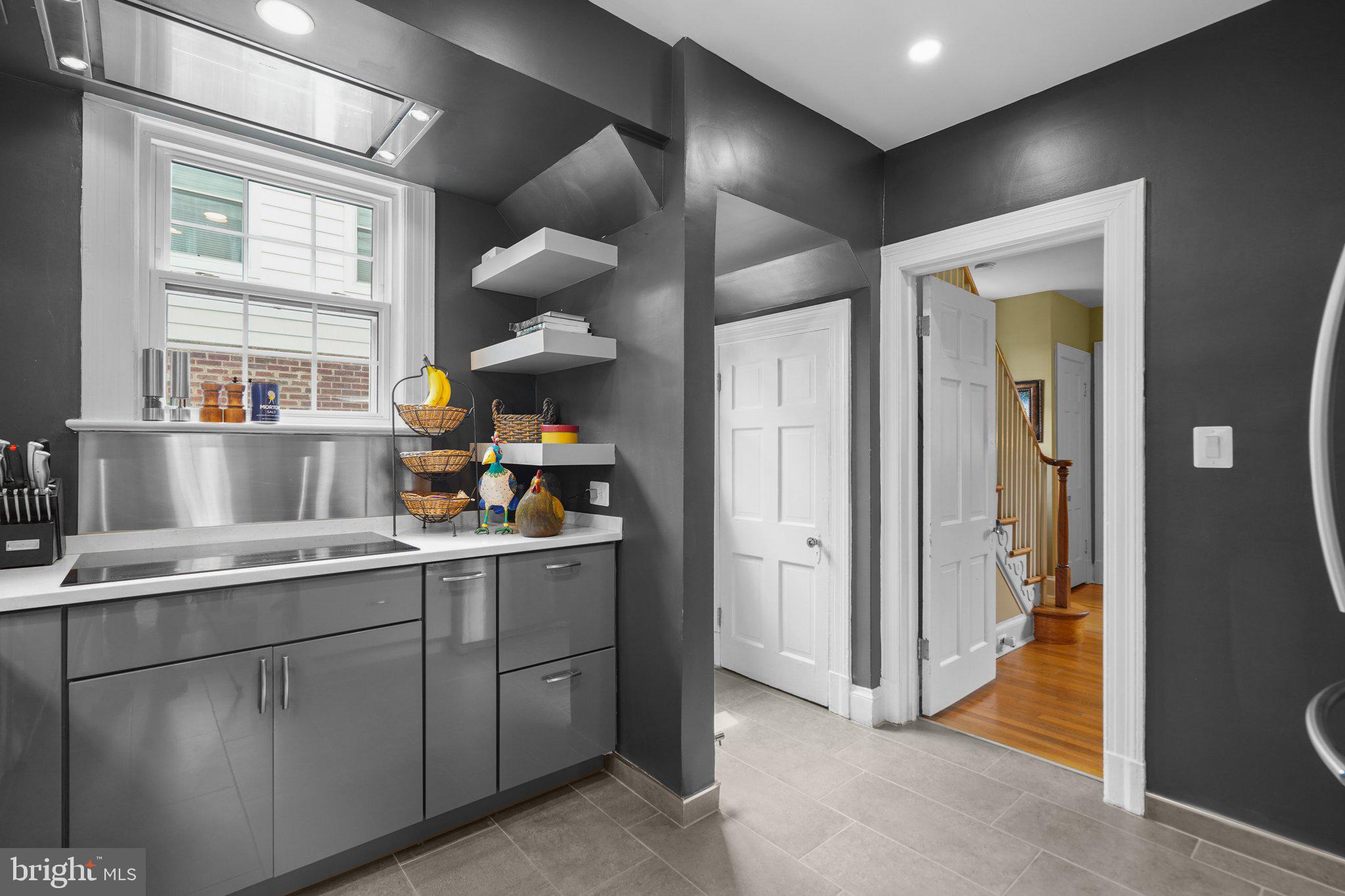 8013 Glenbrook Road Bethesda, MD 20814 - Photo 17 of 41 a kitchen with a sink and cabinets