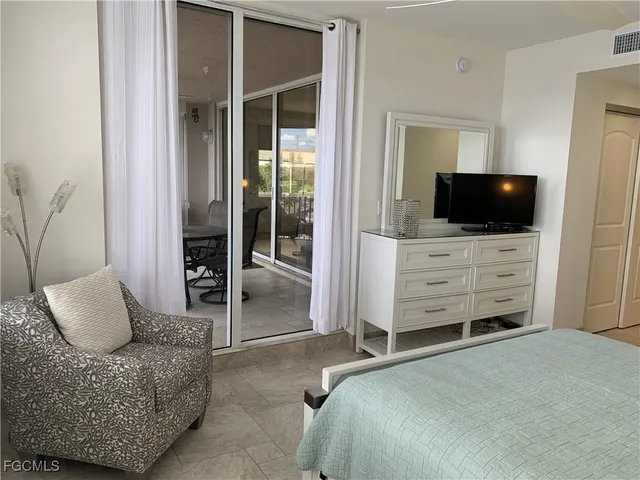 a bedroom with a bed and furniture