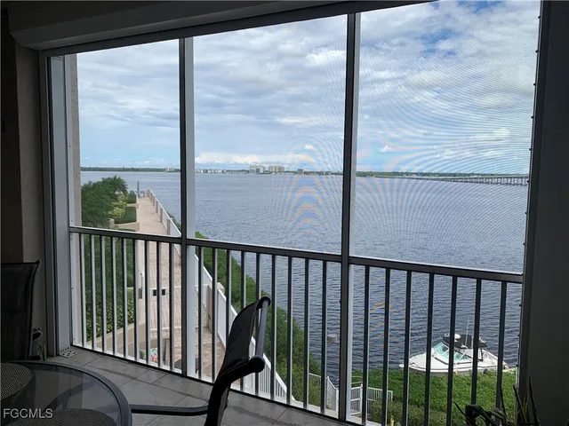 a view of a balcony with a floor to ceiling window