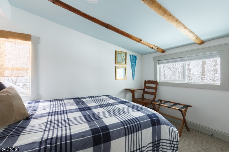 377 Lakeside Road West Milford, NJ 07421 - Photo 16 of 22 a bedroom with a bed and a window
