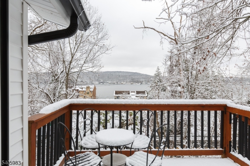 377 Lakeside Road West Milford, NJ 07421 - Photo 17 of 22 a view of a balcony with wooden fence and floor