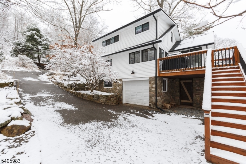 377 Lakeside Road West Milford, NJ 07421 - Photo 20 of 22 a view of a house with a yard covered in snow