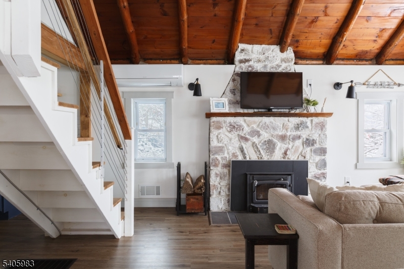 377 Lakeside Road West Milford, NJ 07421 - Photo 2 of 22 a living room with furniture and a fireplace