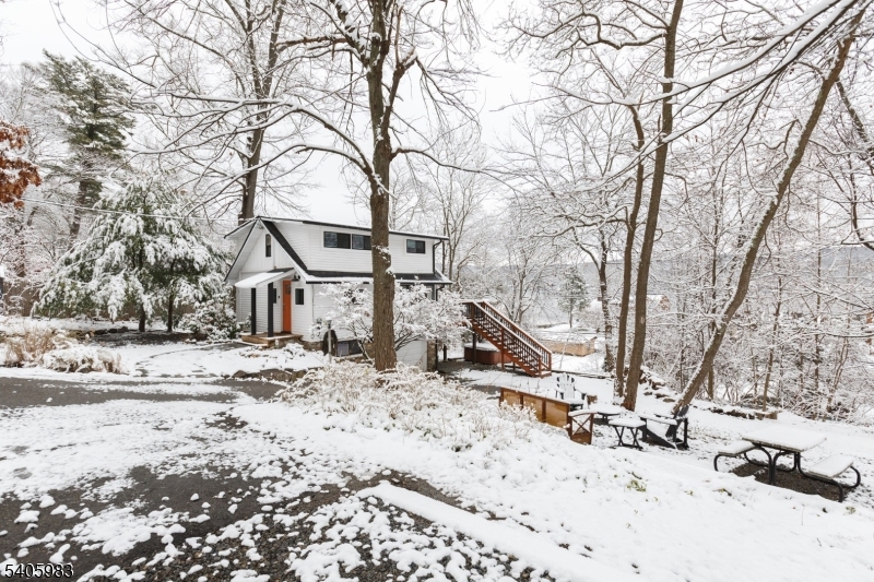 377 Lakeside Road West Milford, NJ 07421 - Photo 21 of 22 a view of a large white house with a snow on the road