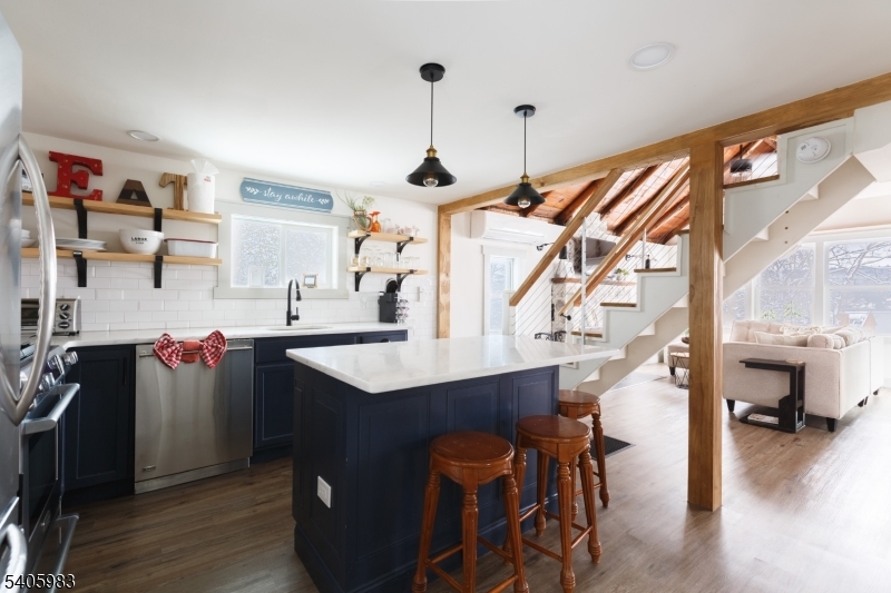 377 Lakeside Road West Milford, NJ 07421 - Photo 7 of 22 a kitchen with a sink a refrigerator and wooden floor