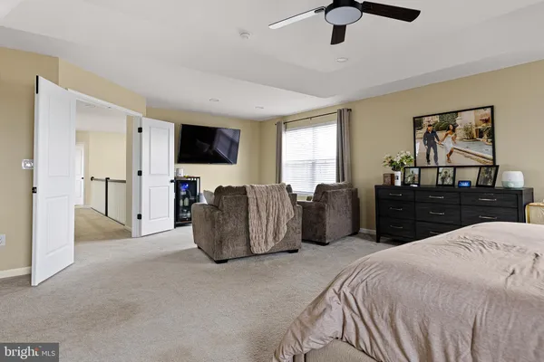a bed room with bed and mirror