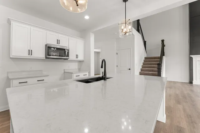 view of kitchen with sink microwave and refrigerator