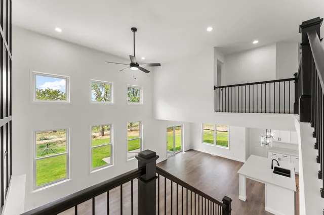 a bedroom with a bed couch and window