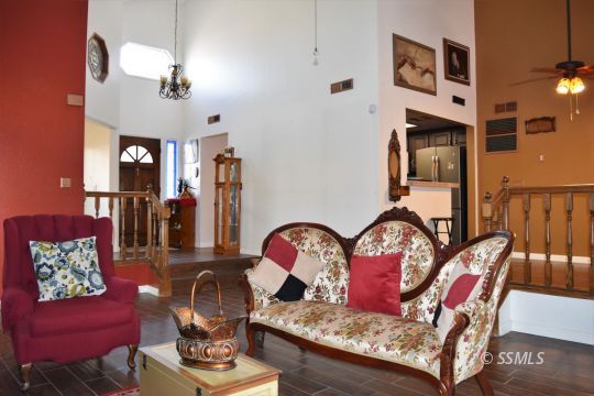 417 Montefino Drive Ridgecrest, CA 93555 - Photo 8 of 25 a living room with furniture and wooden floor