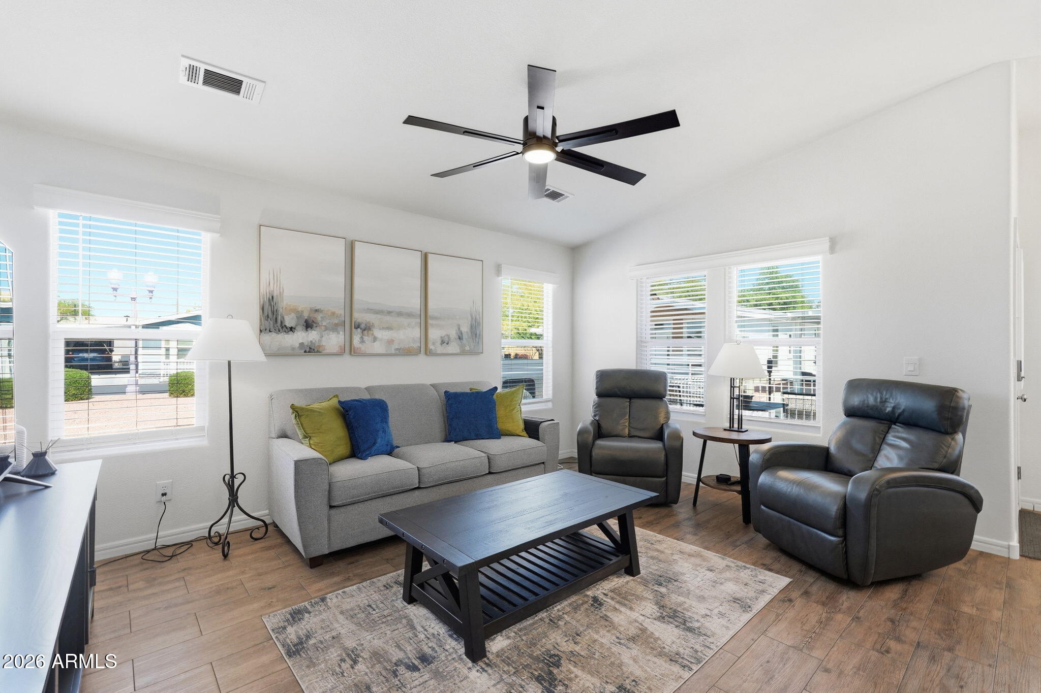 8865 East Baseline Road, Unit 74B Mesa, AZ 85209 - Photo 1 of 55 a living room with furniture and a large window