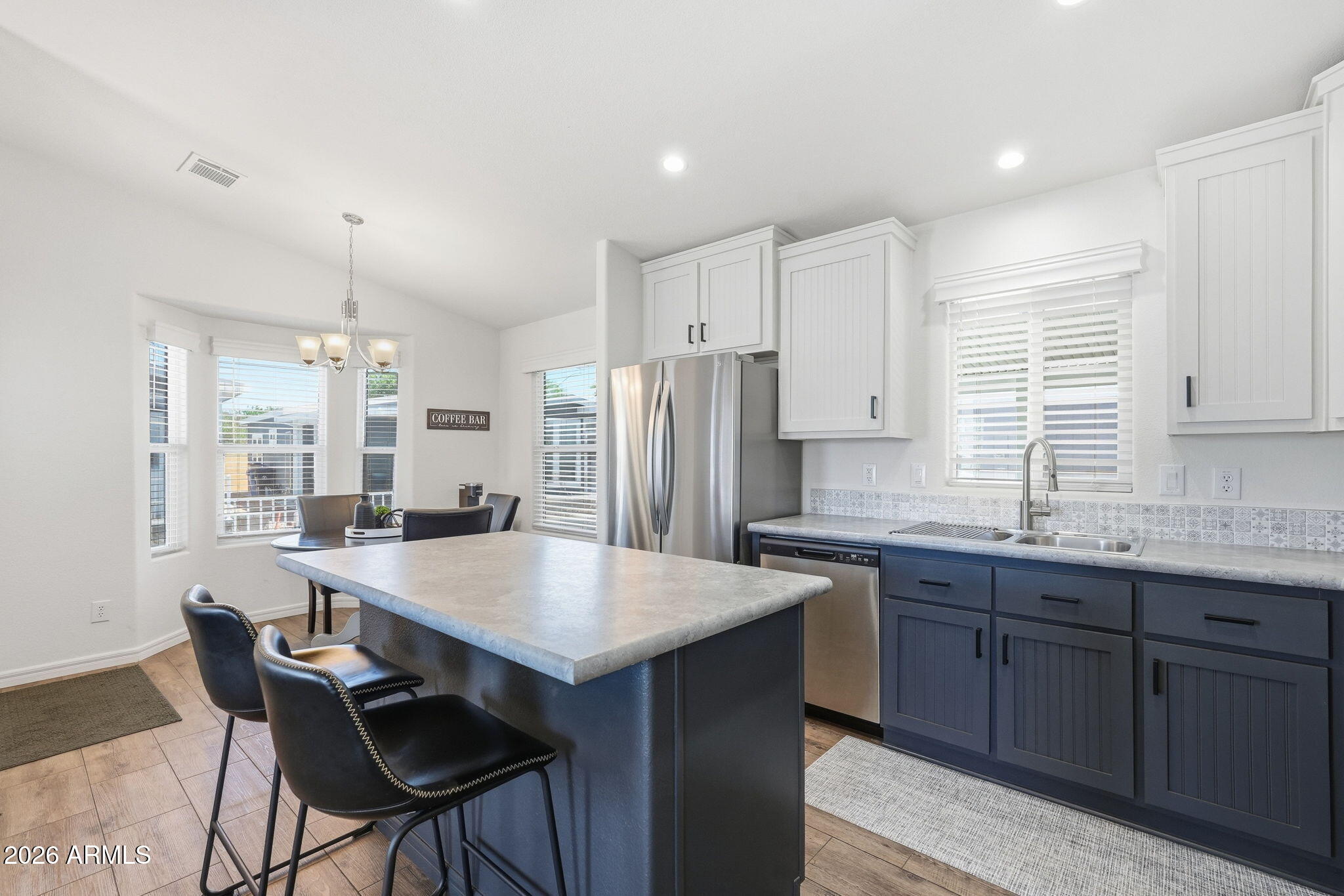 8865 East Baseline Road, Unit 74B Mesa, AZ 85209 - Photo 11 of 55 a kitchen with granite countertop a sink and cabinets