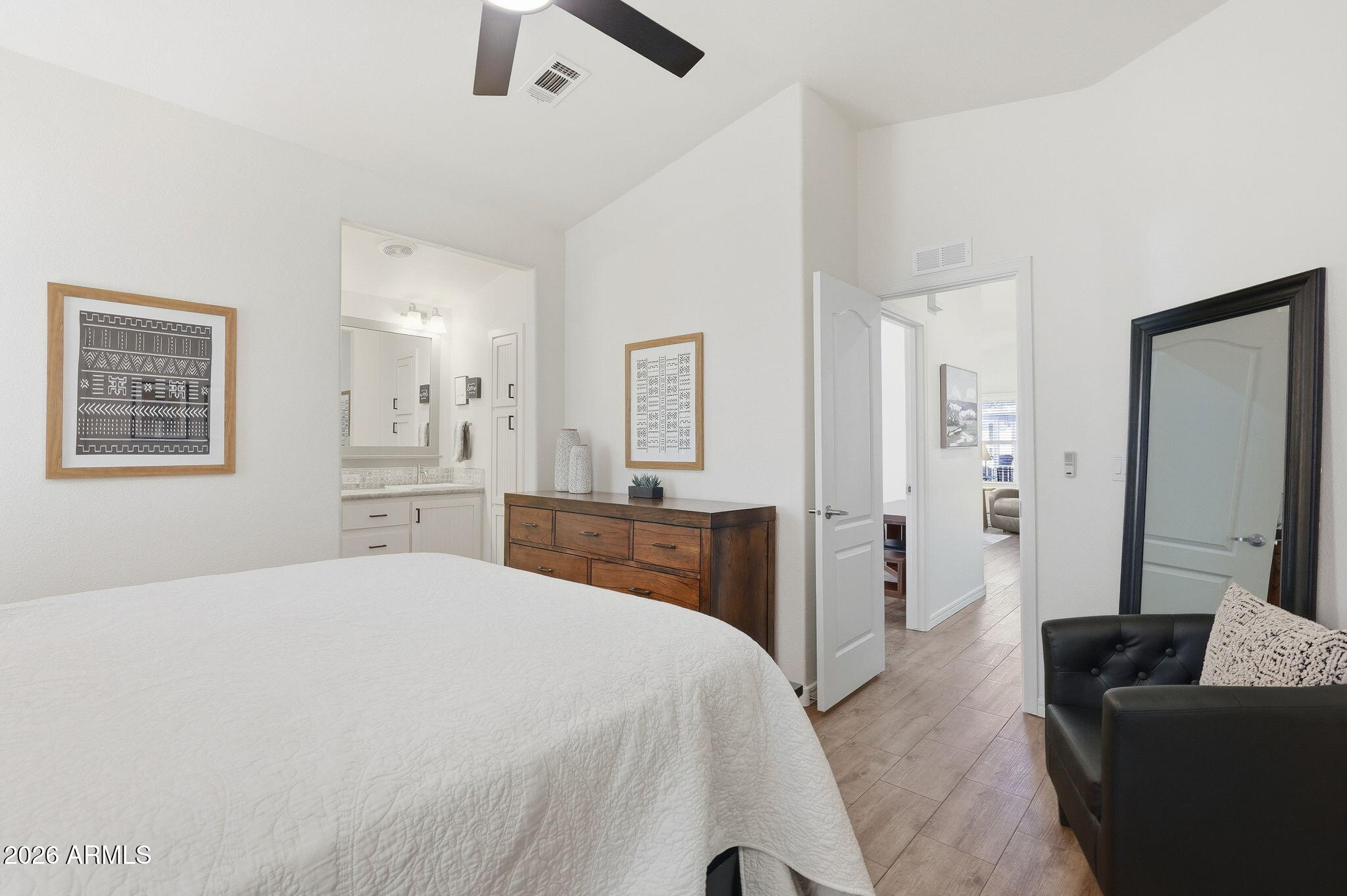 8865 East Baseline Road, Unit 74B Mesa, AZ 85209 - Photo 15 of 55 a bedroom with a large bed and furniture