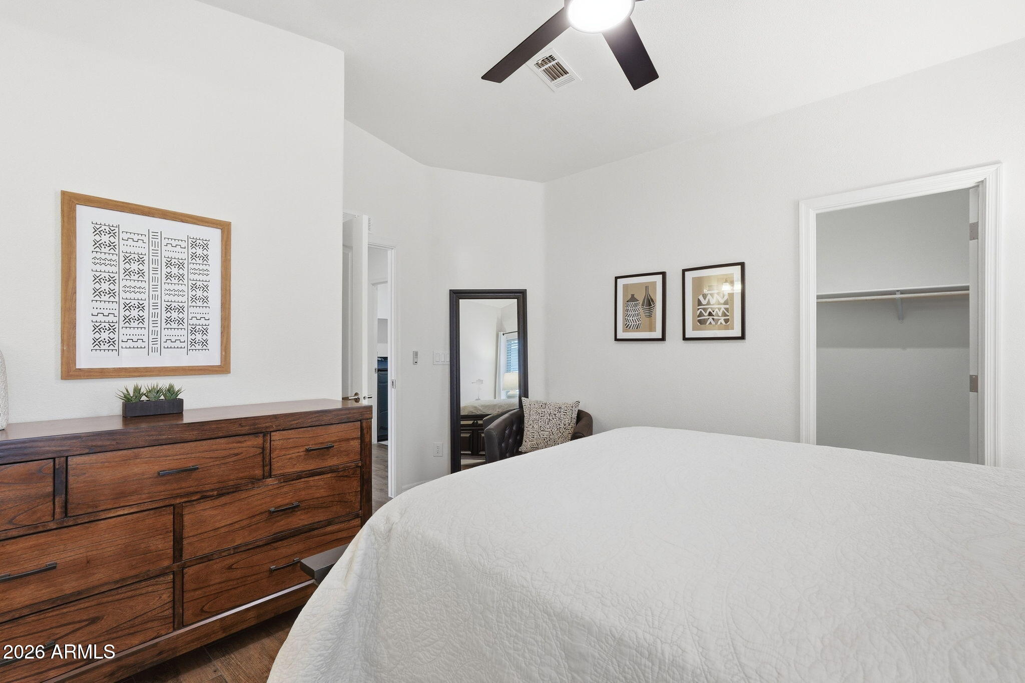 8865 East Baseline Road, Unit 74B Mesa, AZ 85209 - Photo 17 of 55 a bedroom with a large bed and a window