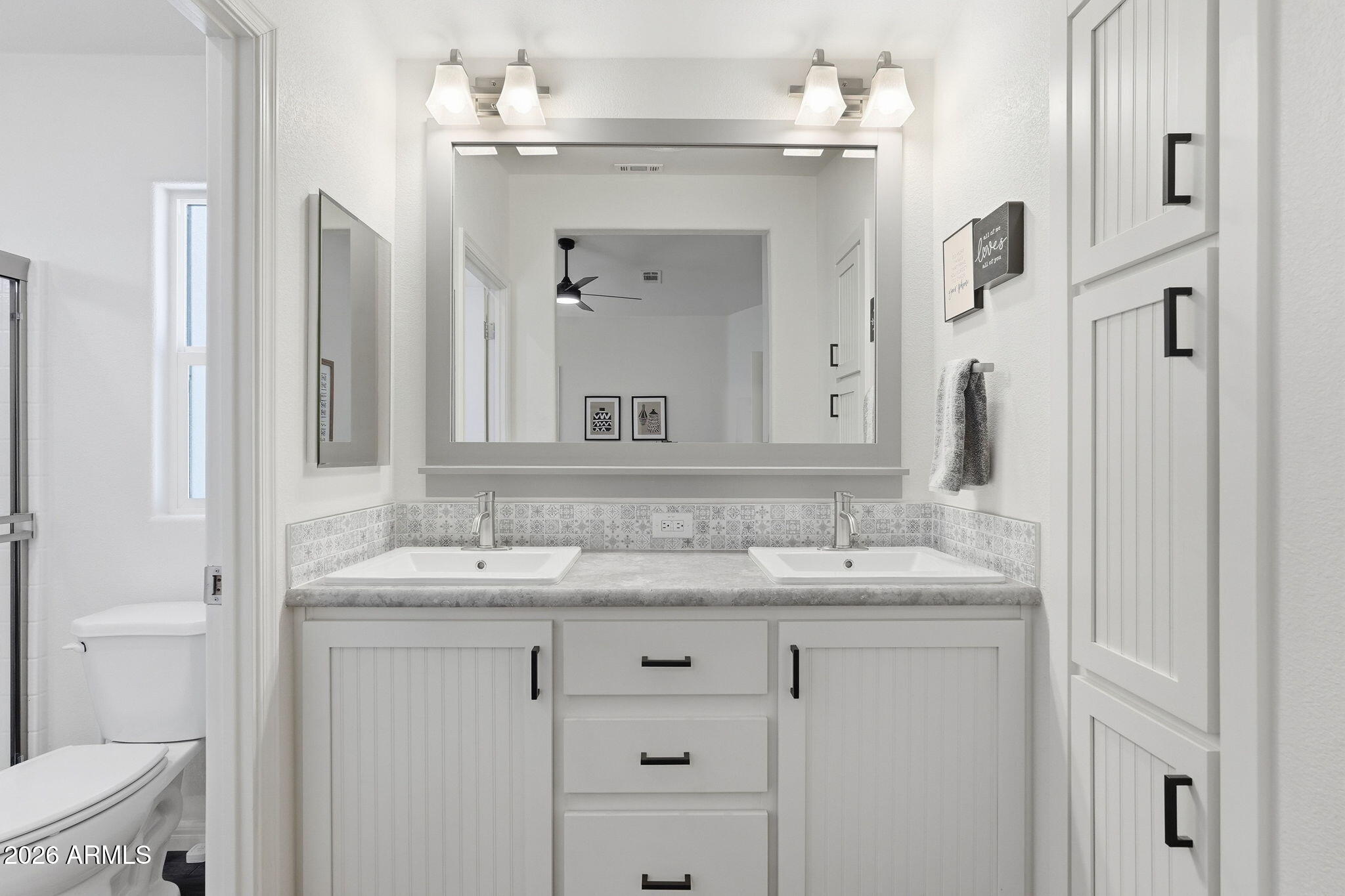 8865 East Baseline Road, Unit 74B Mesa, AZ 85209 - Photo 19 of 55 a bathroom with a granite countertop sink vanity and a mirror