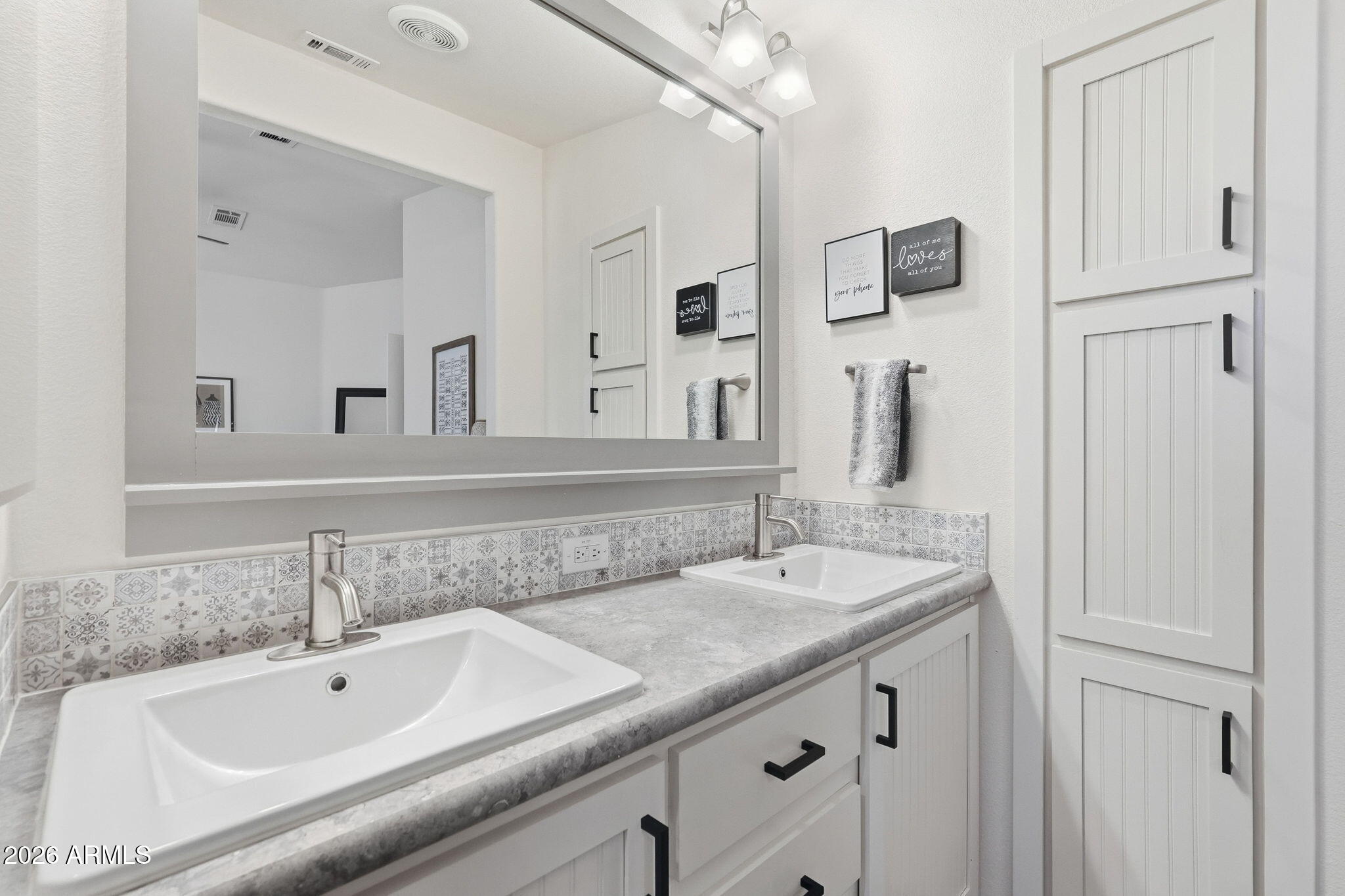 8865 East Baseline Road, Unit 74B Mesa, AZ 85209 - Photo 20 of 55 a bathroom with a sink and a mirror