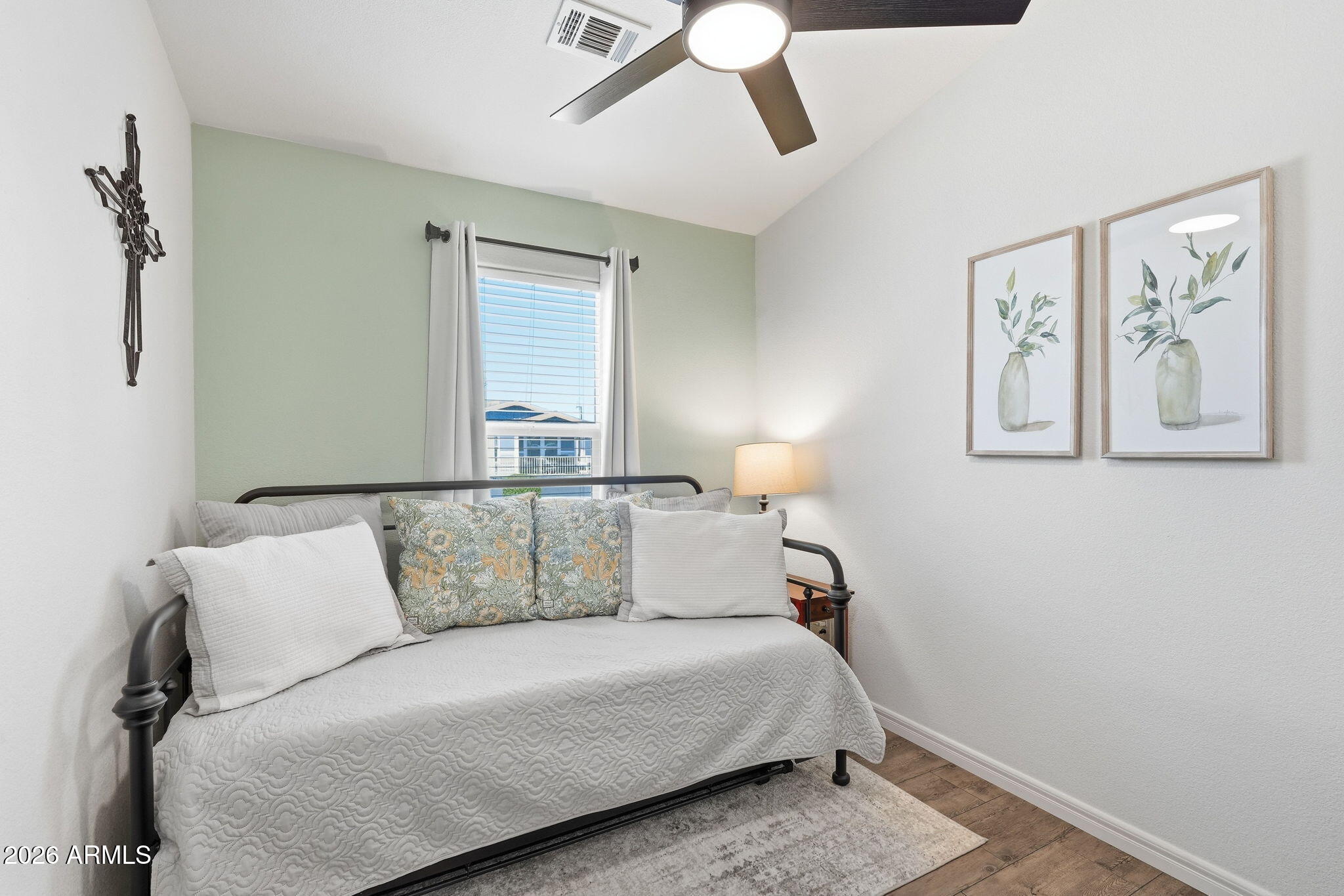 8865 East Baseline Road, Unit 74B Mesa, AZ 85209 - Photo 22 of 55 a bedroom with a large bed and a painting on the wall