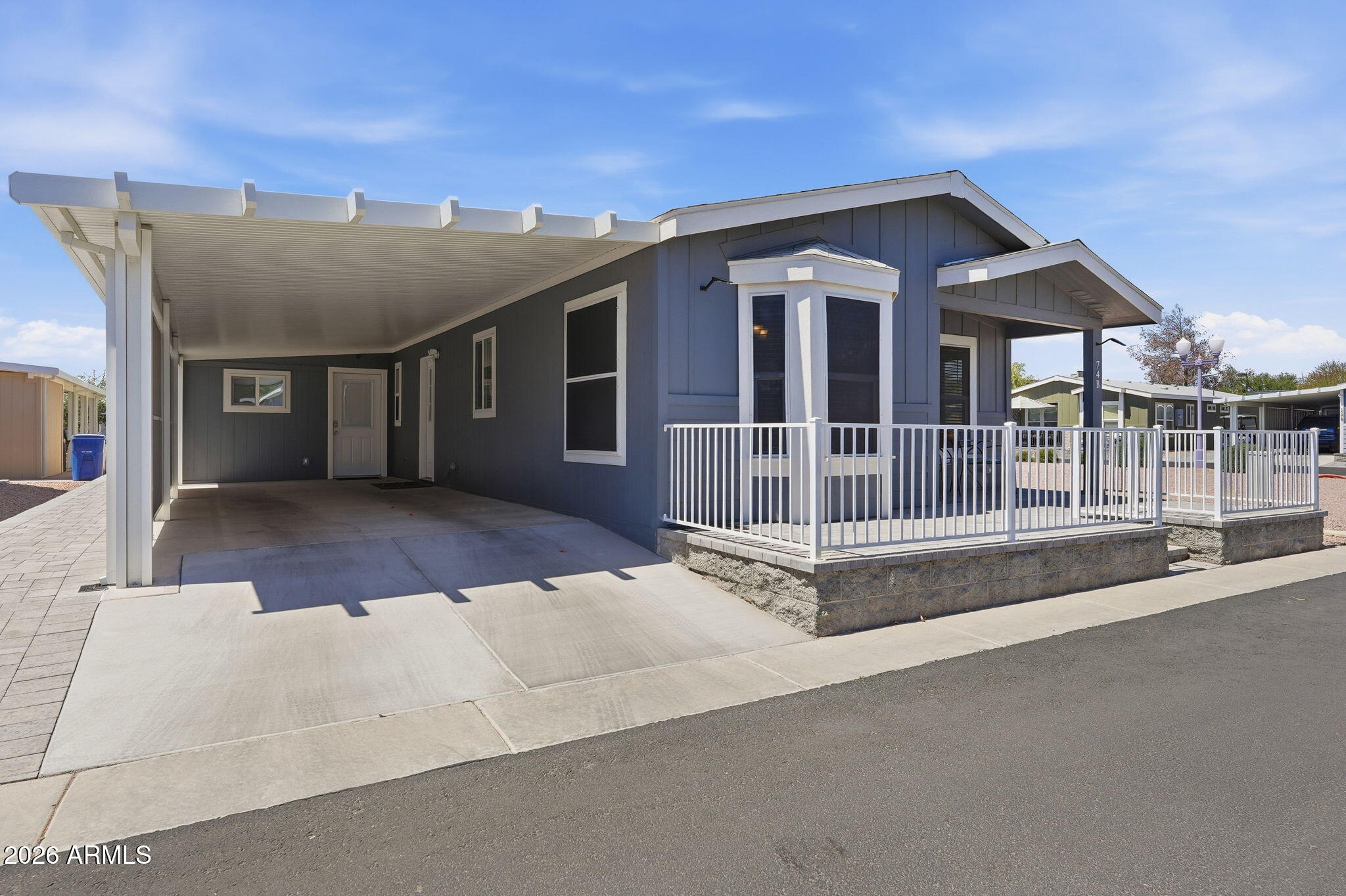 8865 East Baseline Road, Unit 74B Mesa, AZ 85209 - Photo 31 of 55 a front view of a house with a garage